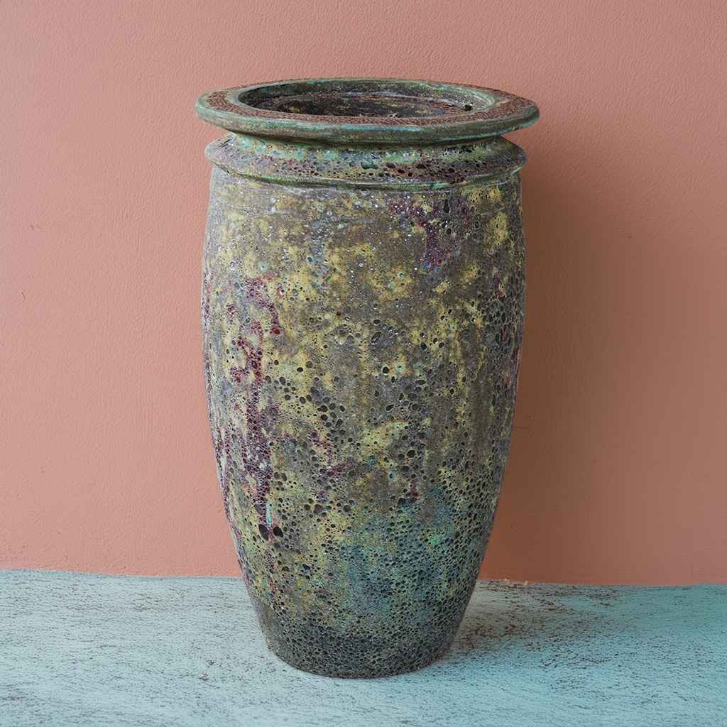 Majestic ceramic jar fountain with a textured, distressed finish in rich green and gold-brown tones