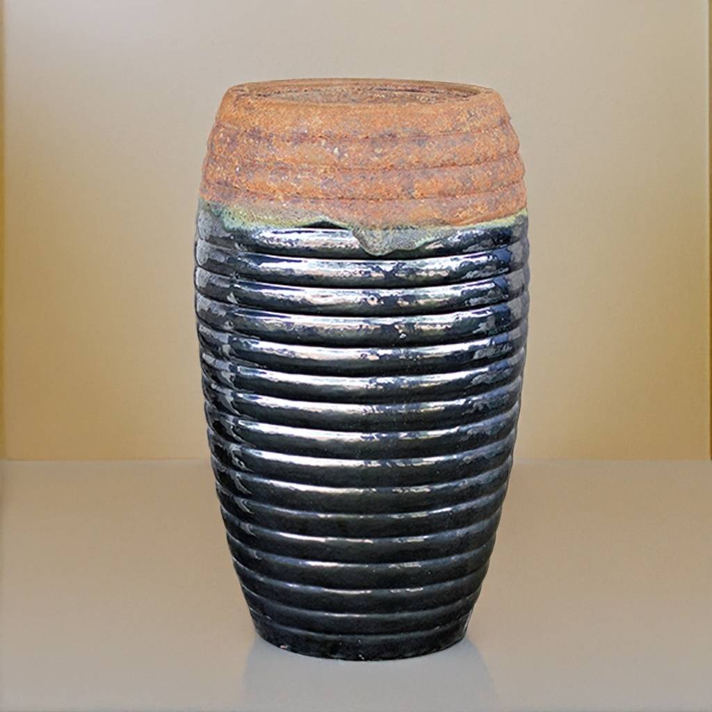 Granular ceramic fountain jar with a glossy black glaze and a rustic, textured top