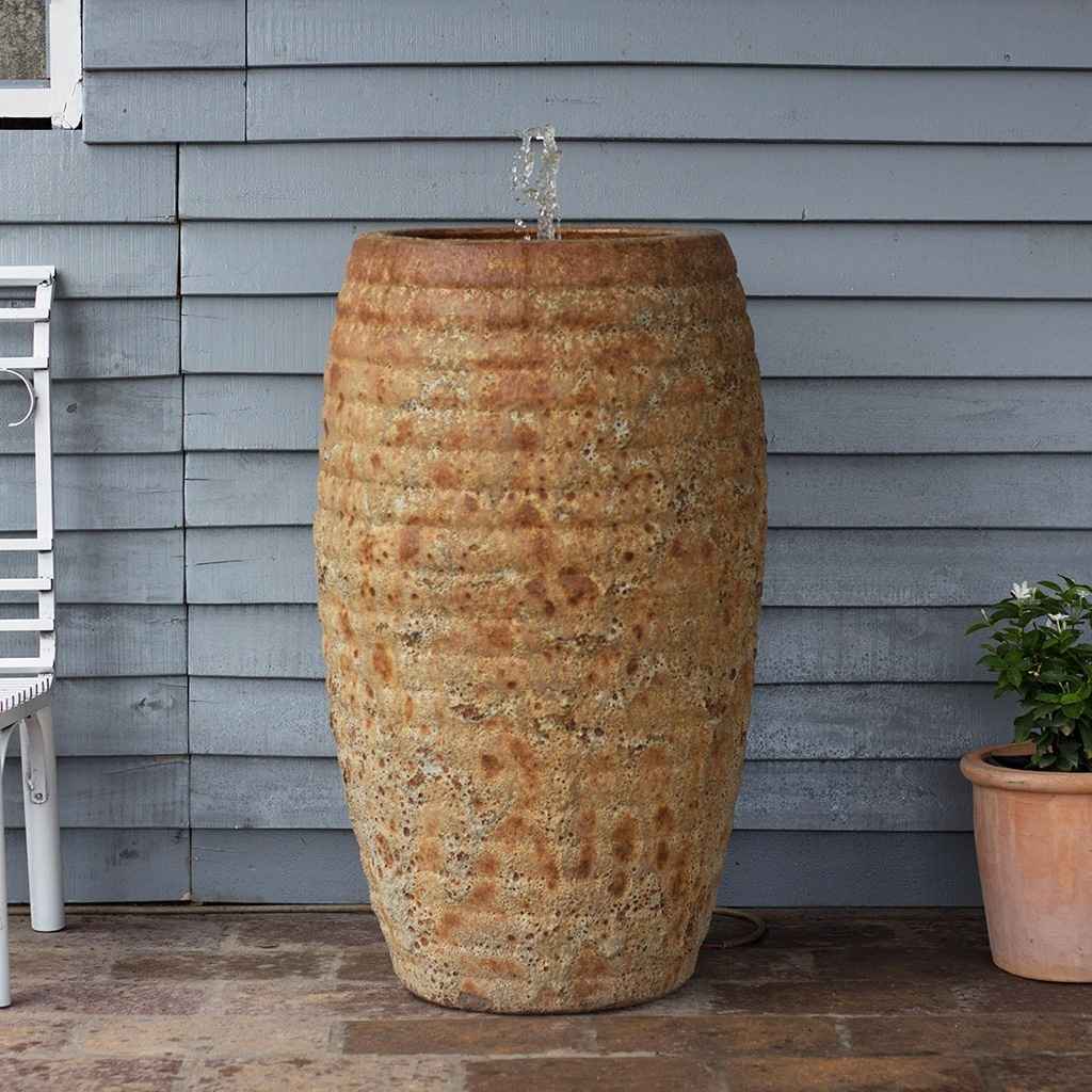 Wholesale Granular ceramic fountain jar with a mottled rustic terracotta finish