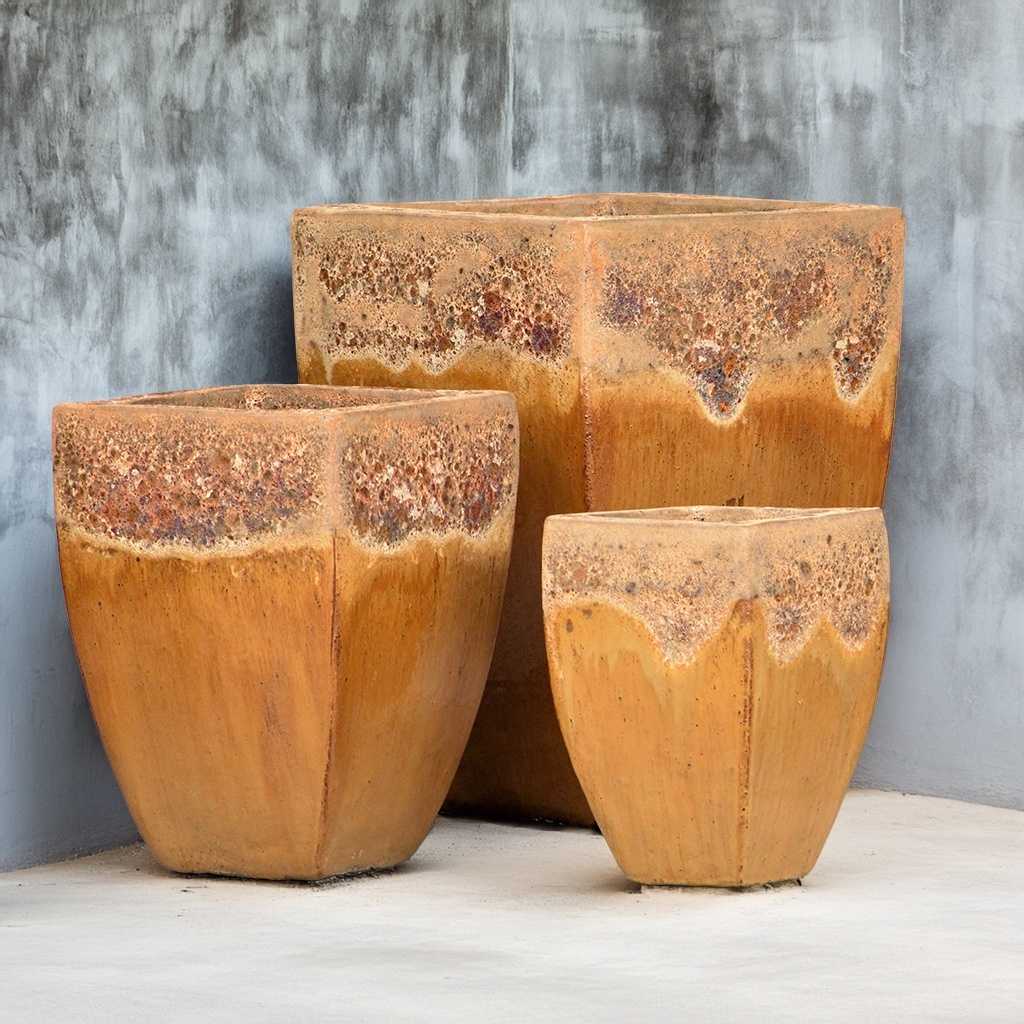 Champagne-glazed tapered ceramic planters with a rustic, unglazed rim
