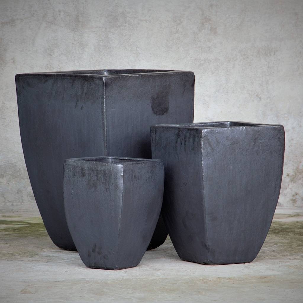 Matte, tapered ceramic planters with dark gray finish