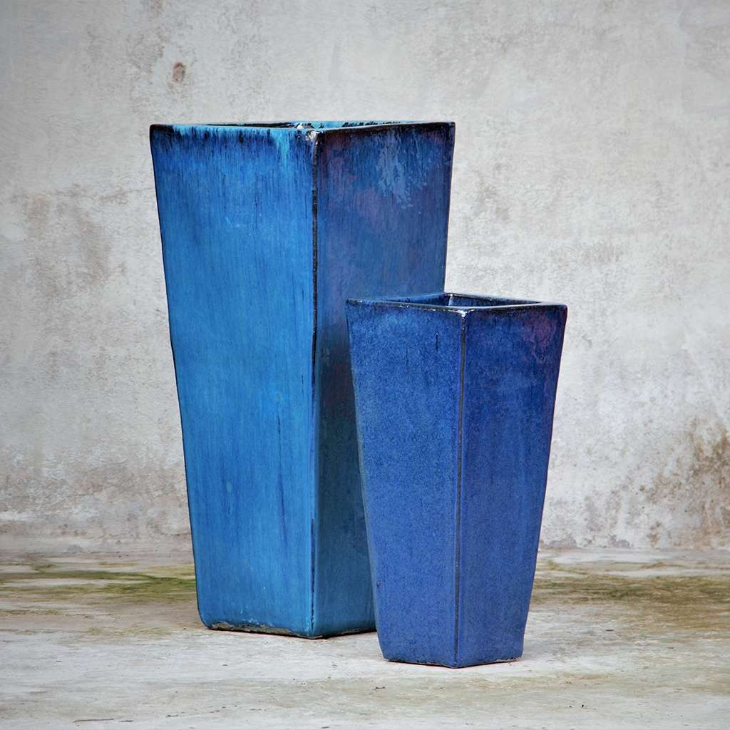Set of 2 glazed blue tapered planters with a smooth, vibrant finish