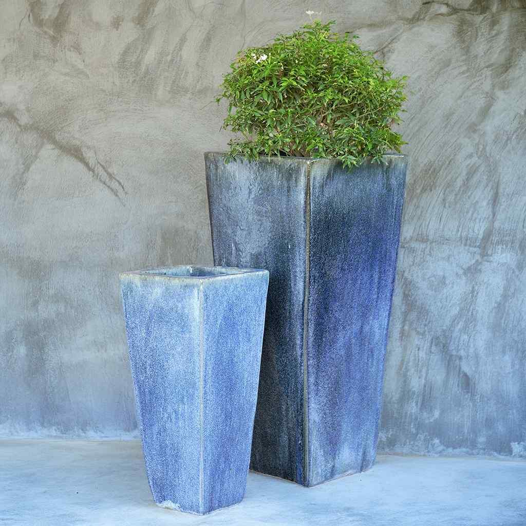 Tapered planters with a glossy, textured blue finish for a sleek and vibrant look
