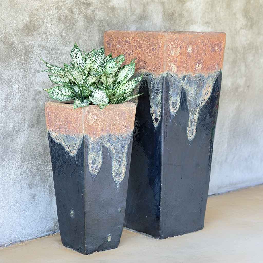 Set of 2 tapered planters in glazed black with rustic, textured rims for a striking blend of modern and earthy style