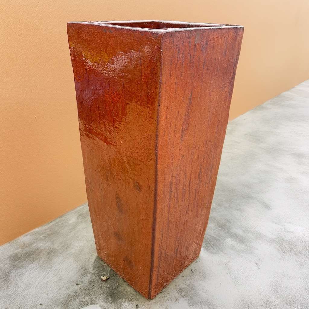 Reddish brown tapered planter with a warm, earthy tone