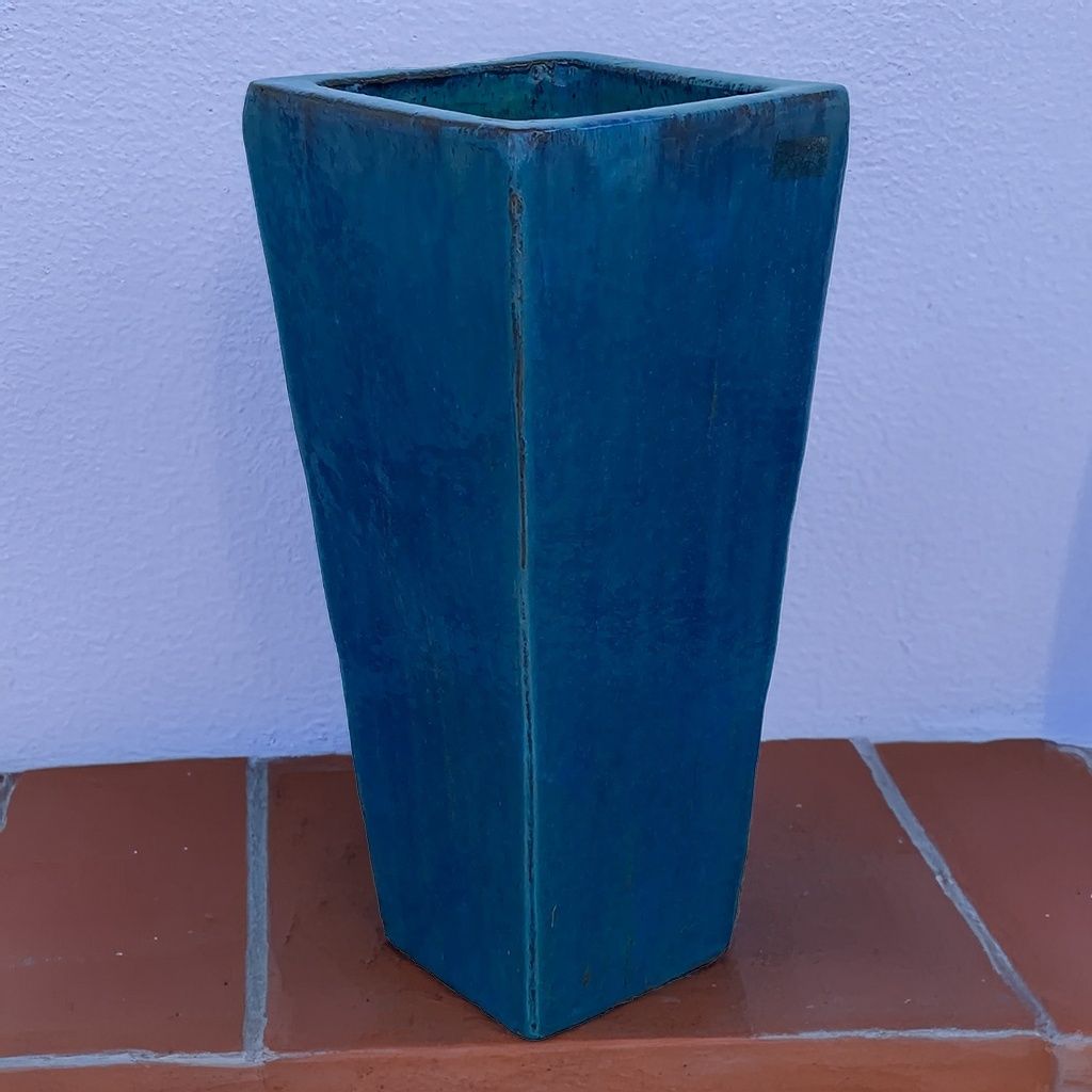 Matte blue tapered planter with a sleek, modern finish
