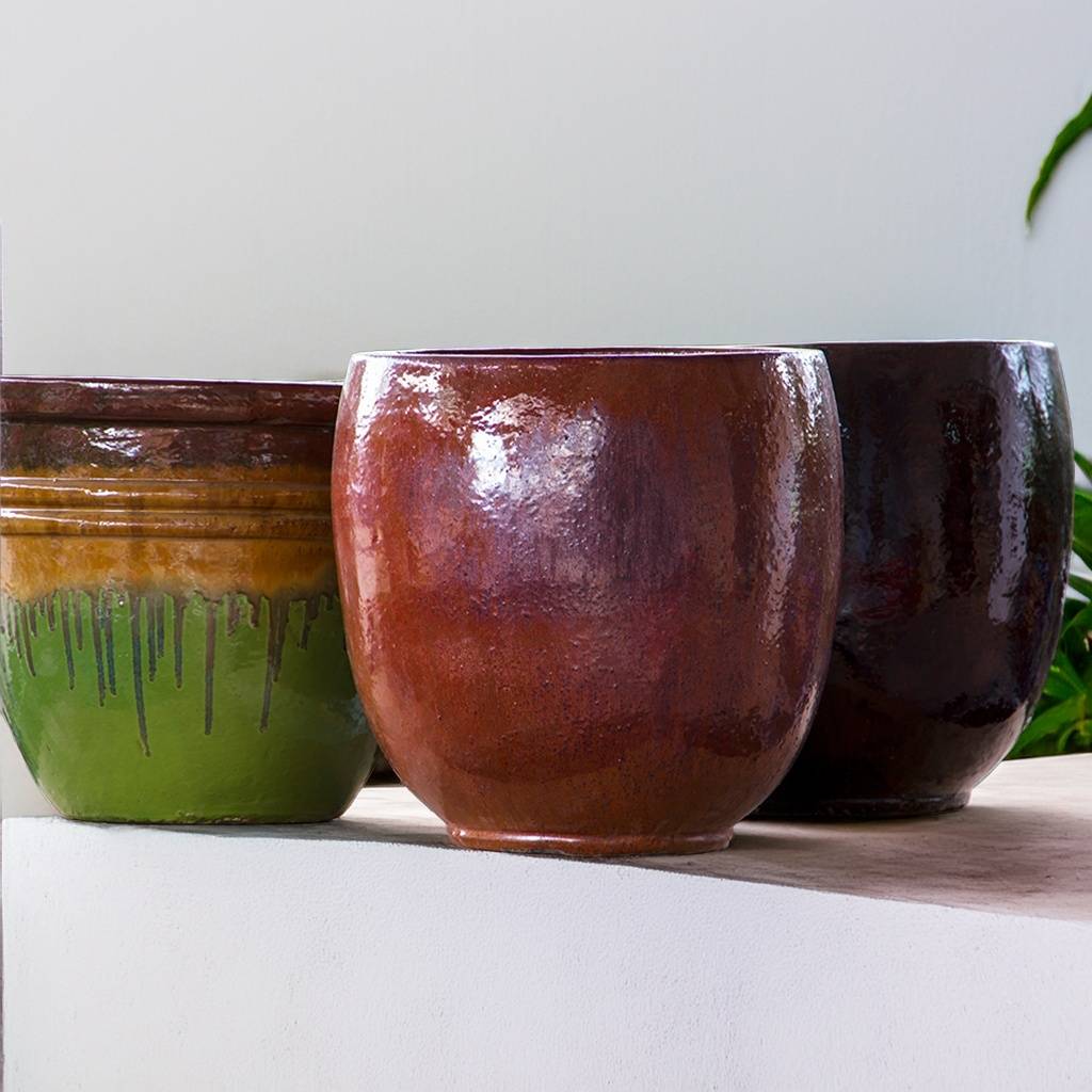 Set of 3 round ceramic bulbous planters in dark brown, copper red, and green, each featuring brown accent details for a rich, earthy look