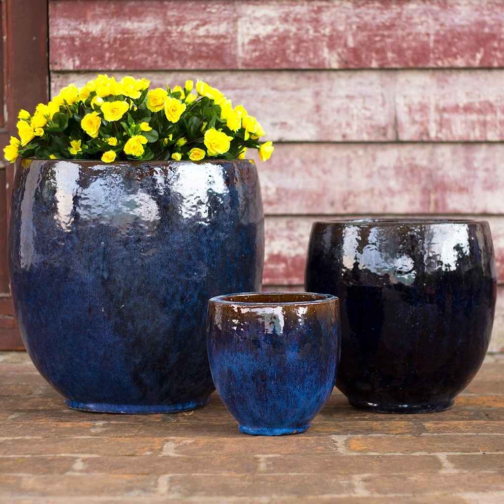 Set of round, bulbous ceramic planters with a glossy deep blue and brown finish