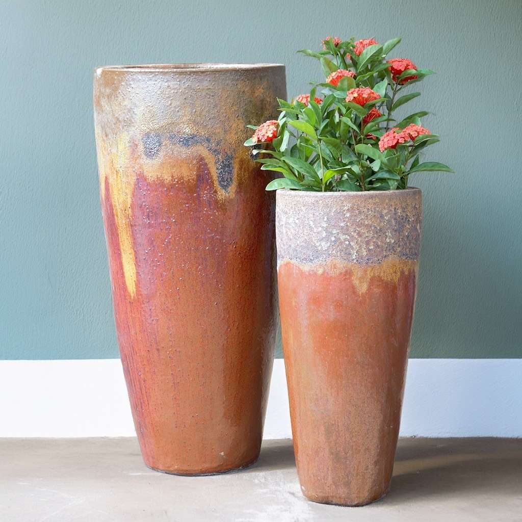 Tall, tapered ceramic planters in copper red with an aged, textured rim for a rustic, vintage-inspired look