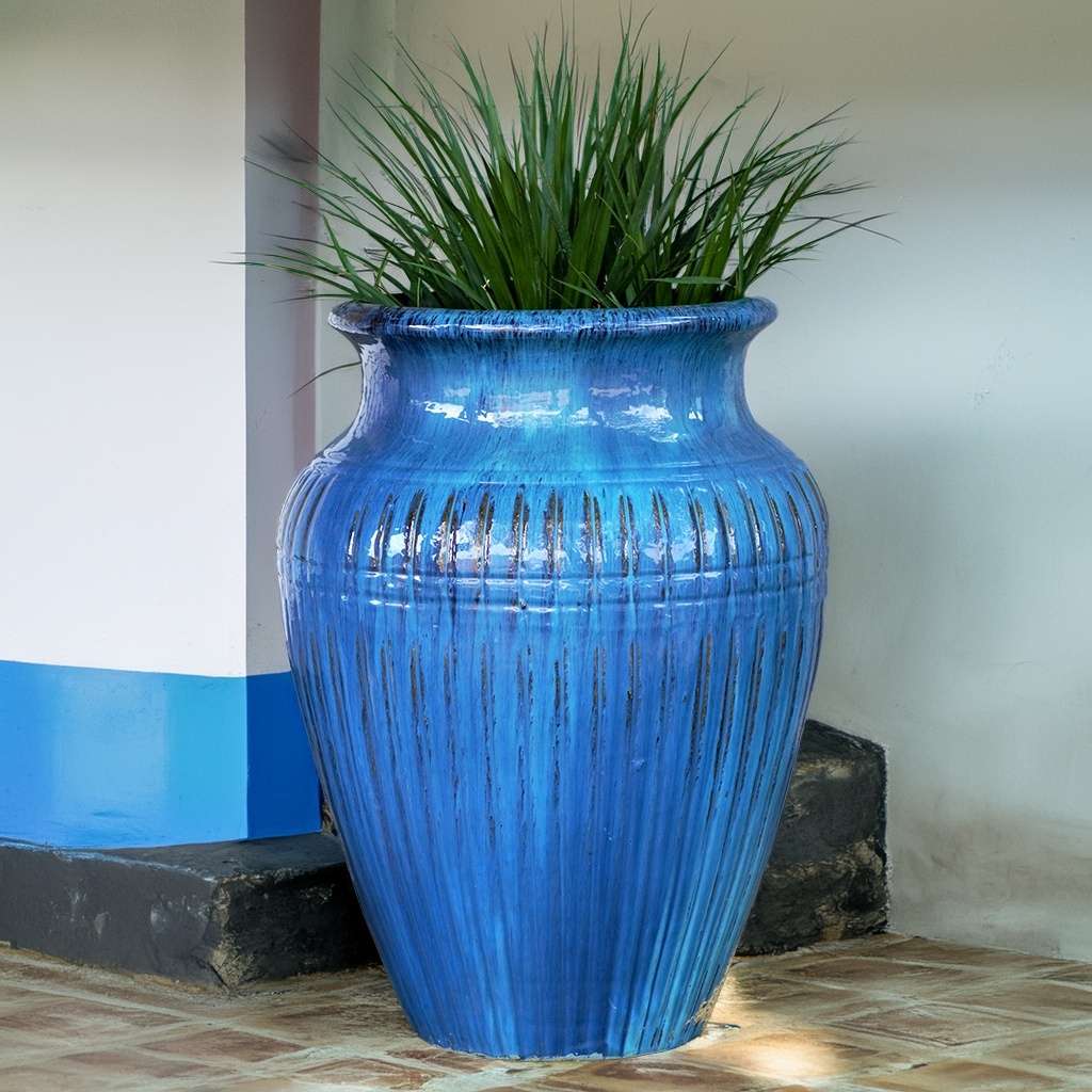 Fluted amphora planter in blue with vertical grooves and a classic, elegant shape