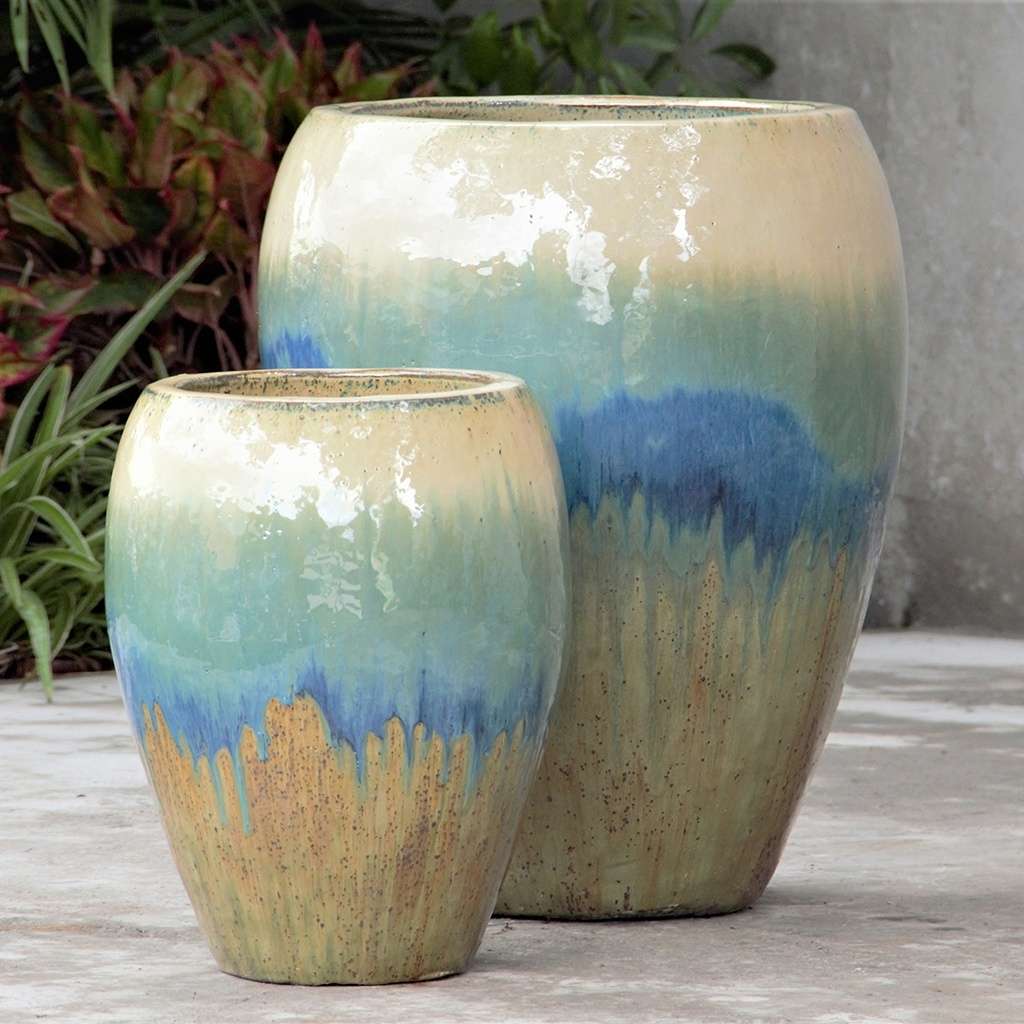 egg-shaped planter pot with smooth curves featuring a gradient of aqua green, blue, and beige-brown tones for a soft, natural look