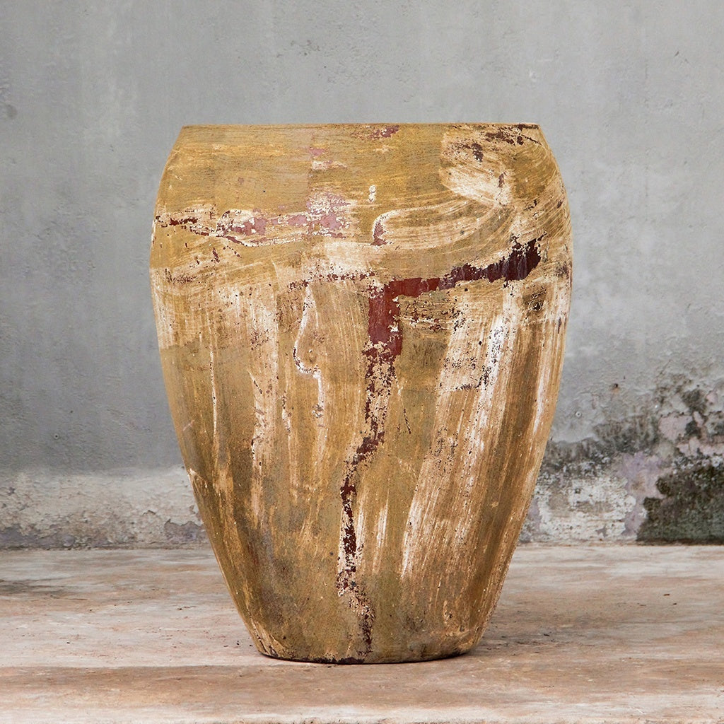 Egg-shaped planter in earthy tones with a distressed, textured surface
