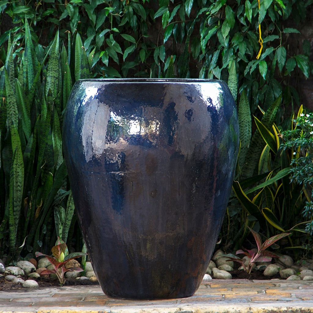 egg-shaped planter in black brown glazed