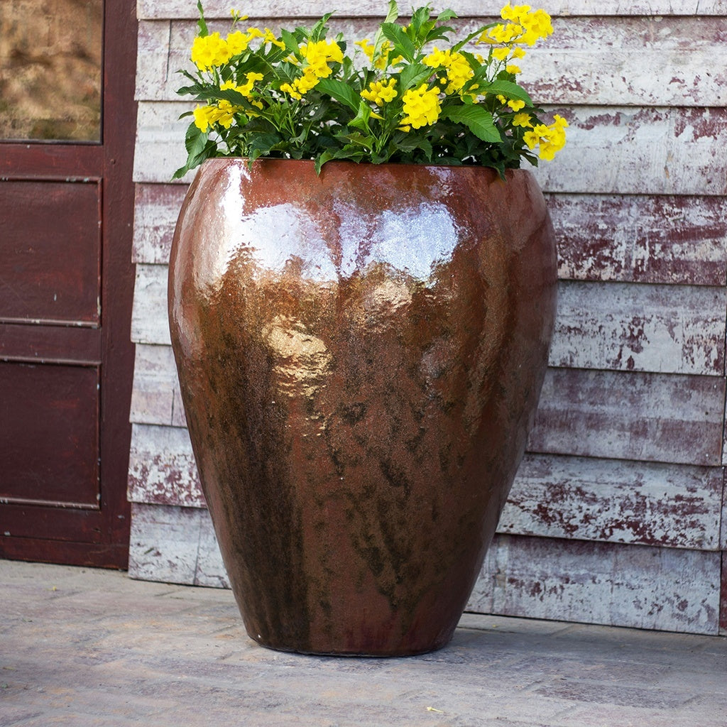 Egg-shaped planter with glazed brown finish