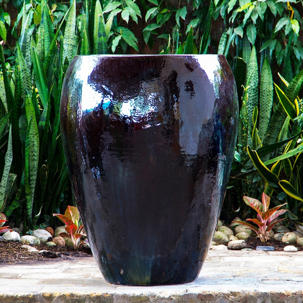 egg-shaped planter in glossy dark red finish