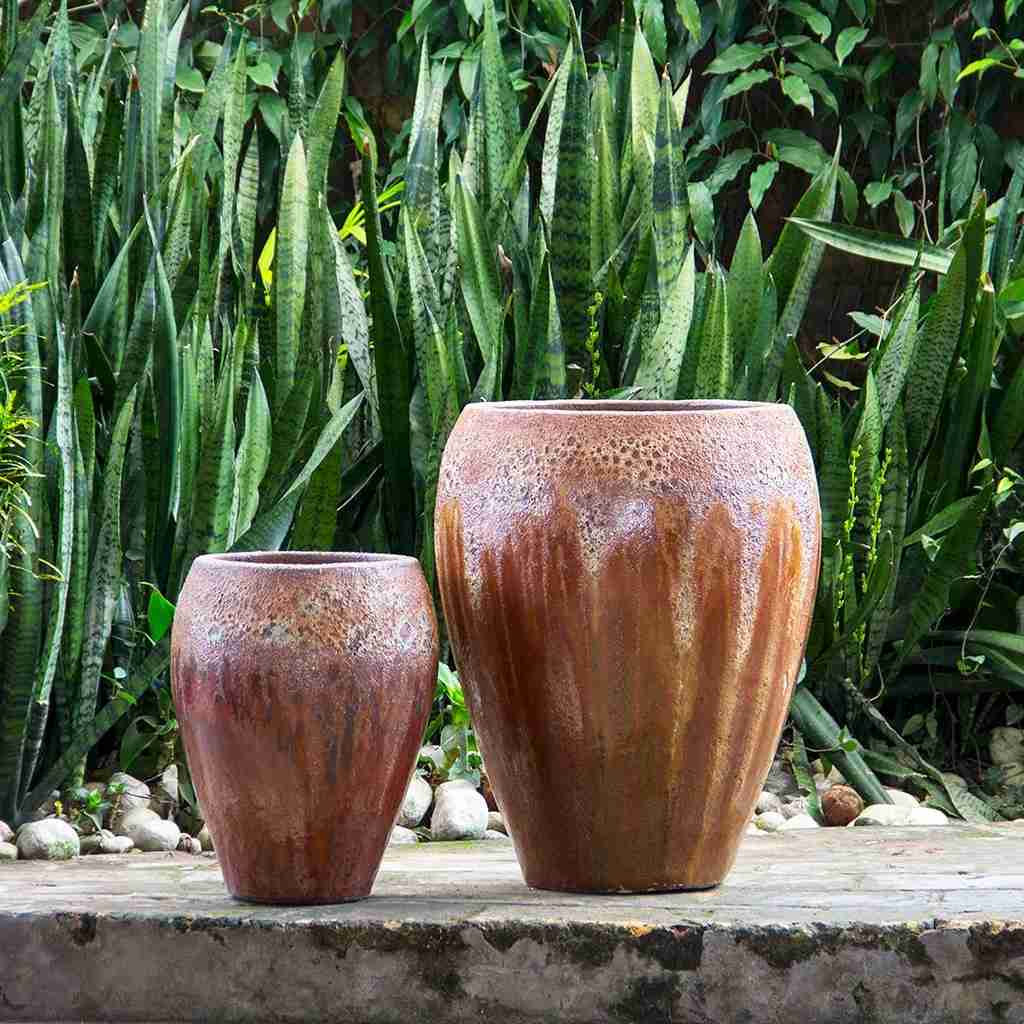 Glazed egg-shaped planter in copper red