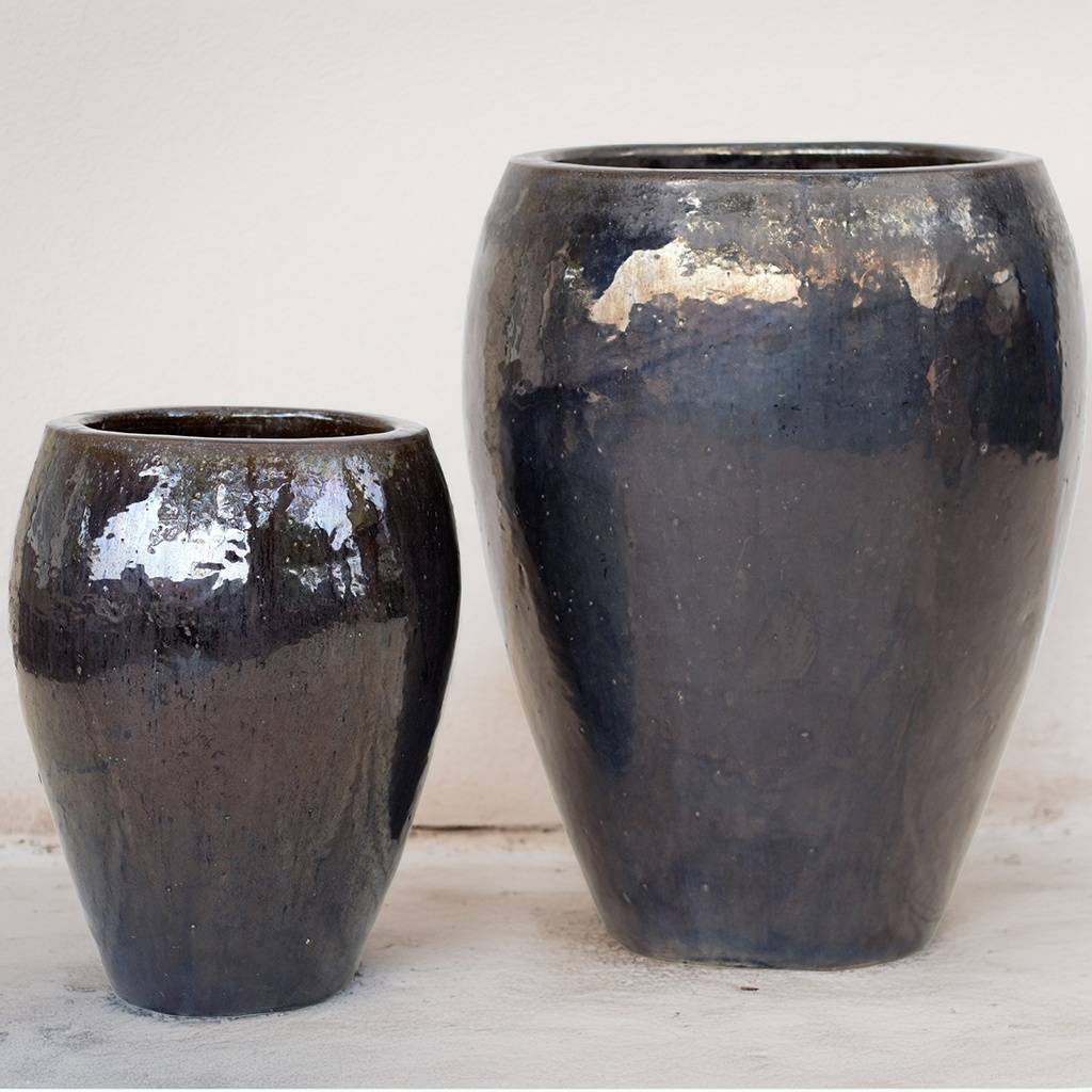 Egg-shaped planter with metallic black/brown finish
