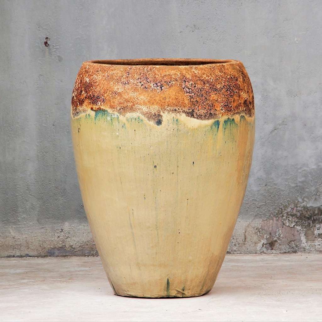 Cream egg-shaped planter with distressed brown and green rim finish