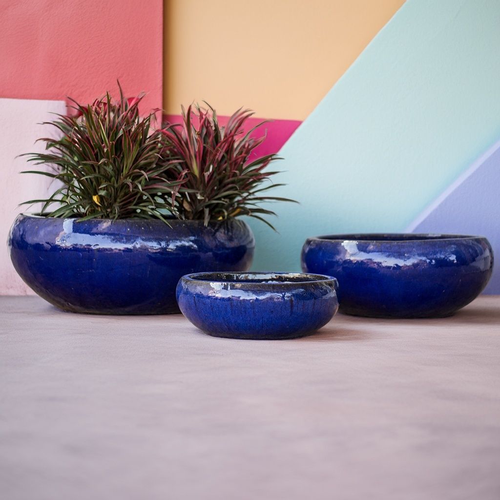 Set of 3 glazed ceramic low bowl planters featuring a glossy dark blue finish and smooth, rounded profiles for a sleek, modern look