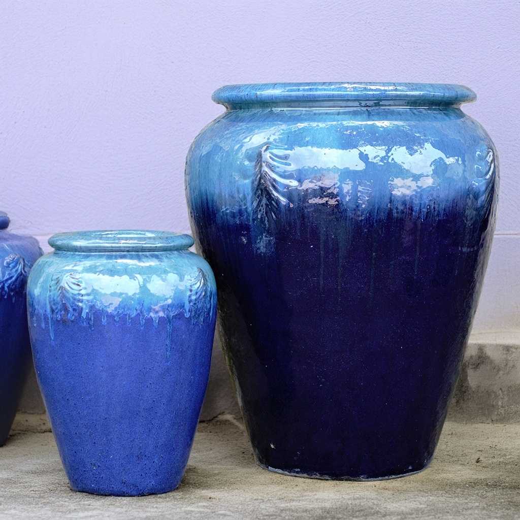 Tall, rounded jar-style planters in glazed blue
