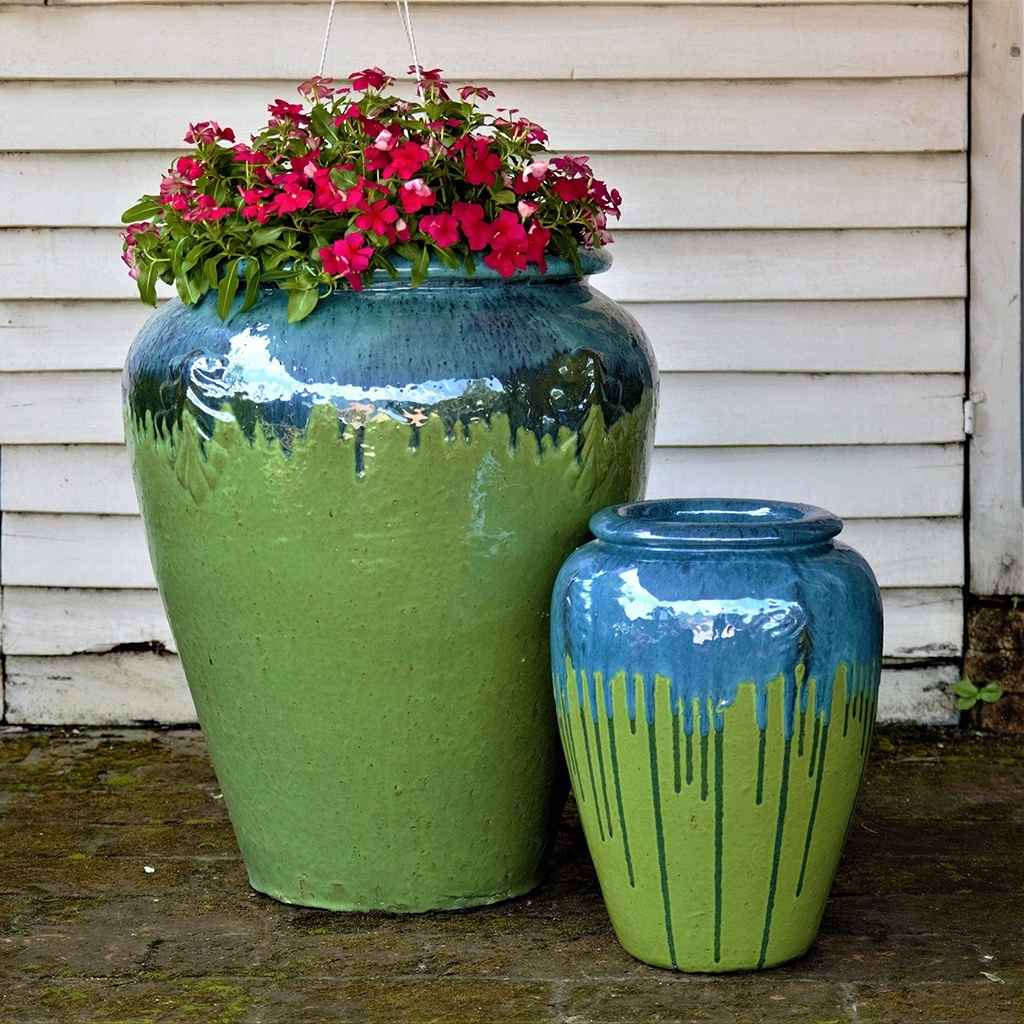 Tall, rounded jar-style planters in apple green featuring a glossy blue green rim and a distinctive dripping glaze effect