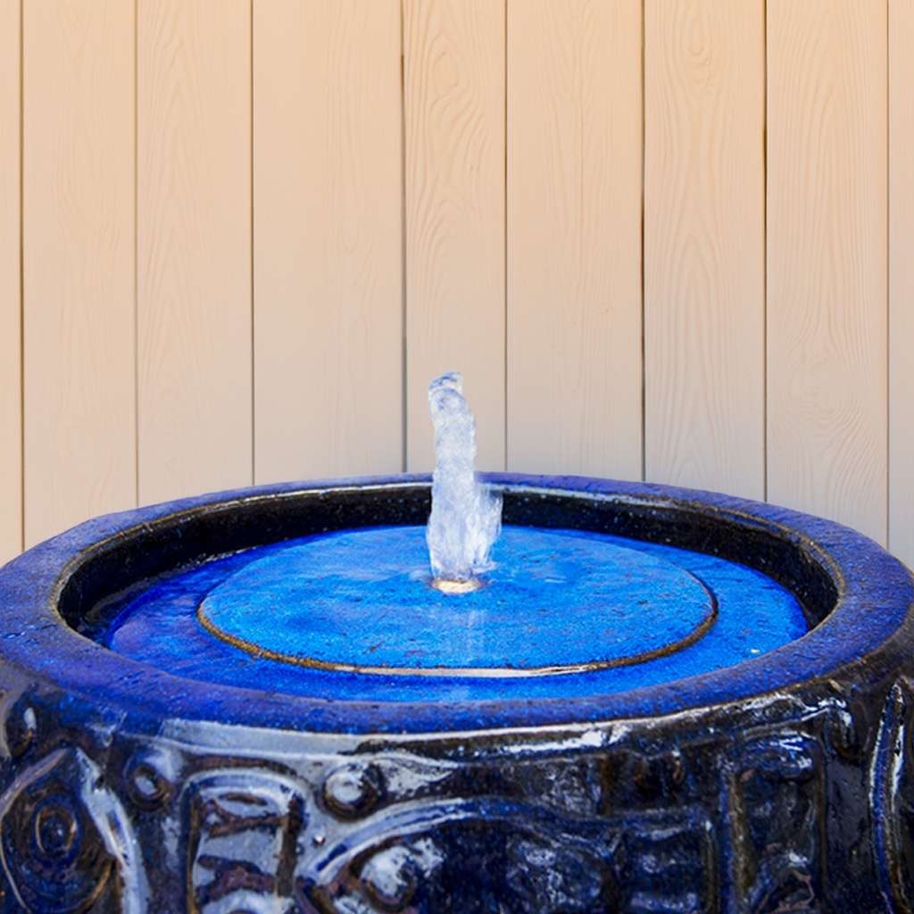 Top view of an embossed fish ceramic planter in deep dark blue