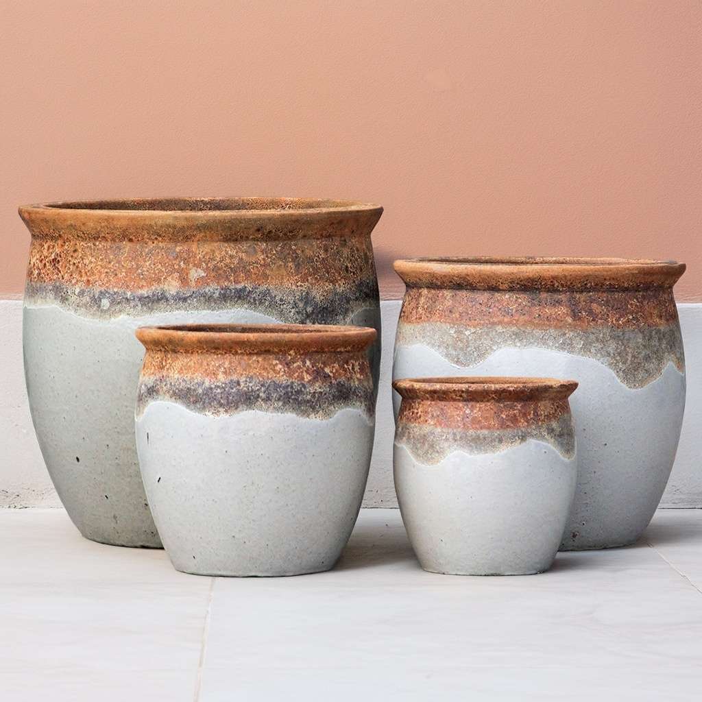 Rustic rounded ceramic planter in white with textured top