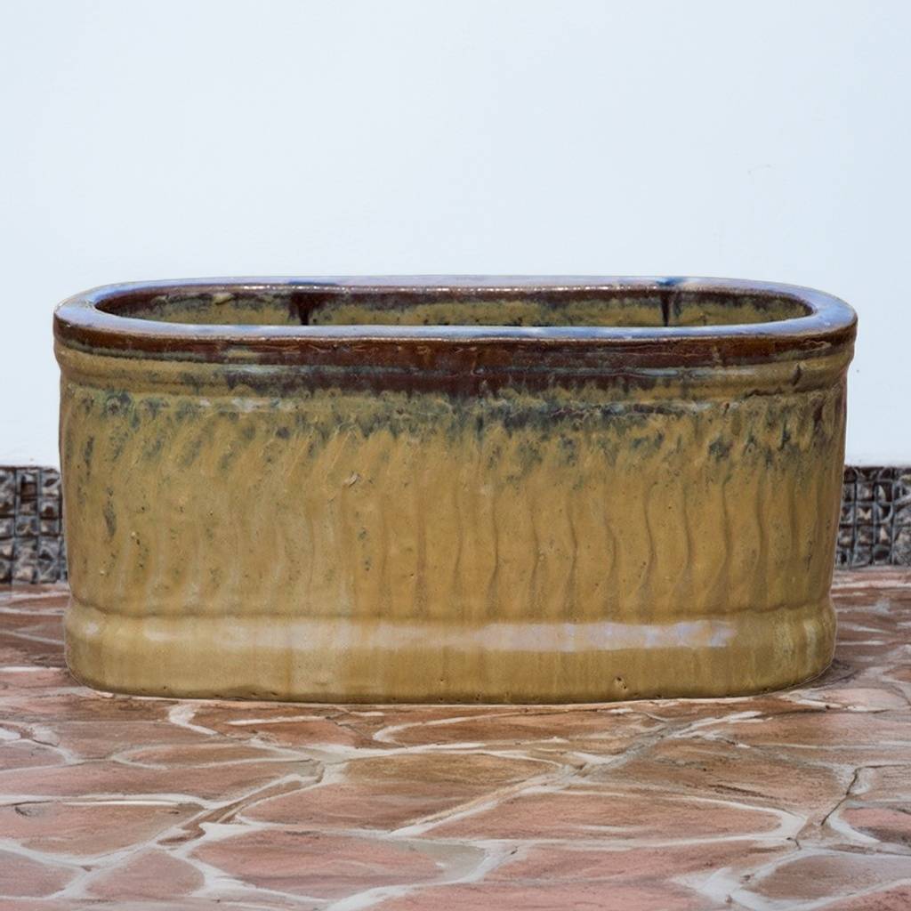 Rectangular planter with wavy embossed texture in beige, featuring brown rim accents