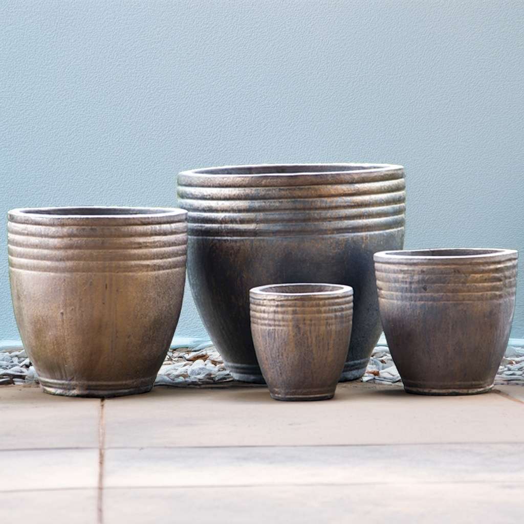 Ribbed ceramic planter in metallic bronze with horizontal banding