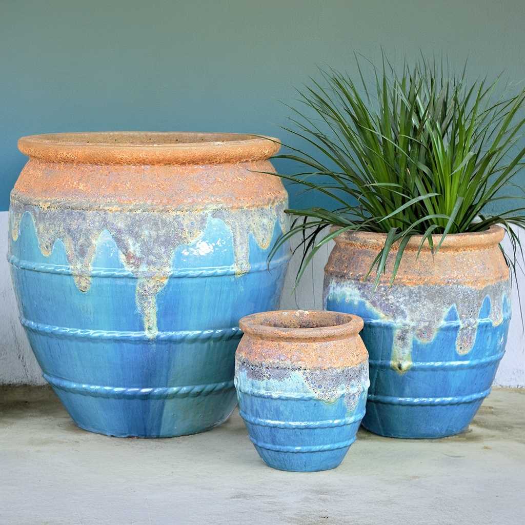 Bulk Rounded ceramic planters in aqua blue featuring a rustic brown drip rim and rope-texture accents