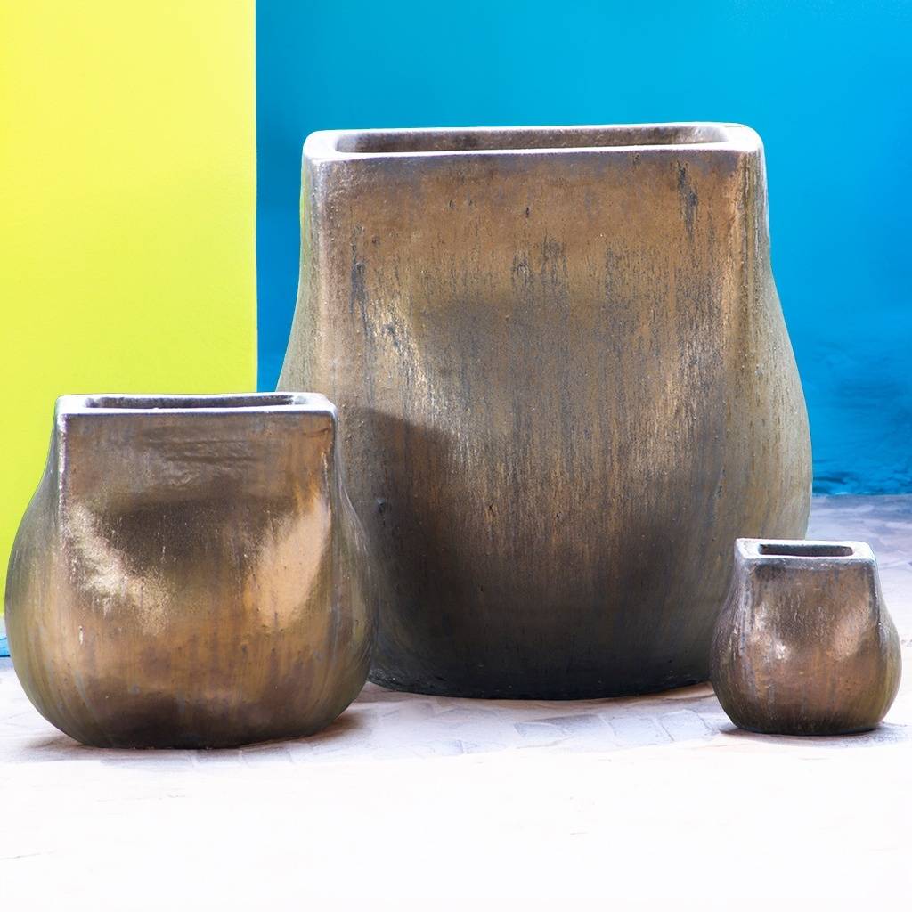 Grooved square planter in bronze featuring rich shades of brown and gold for a warm, metallic look