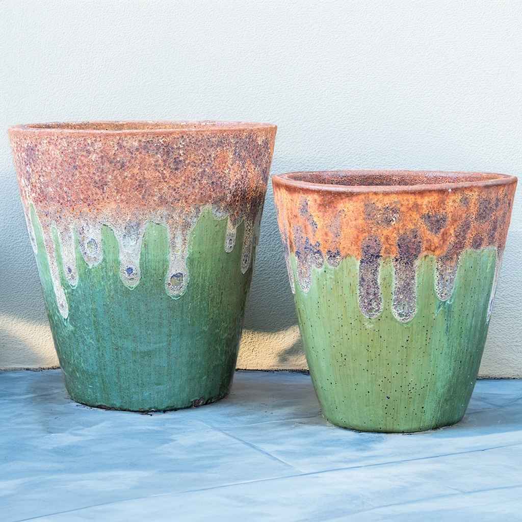 Wholesale Tapered cylinder planter pots with a green glaze and a rustic wide mouth, blending elegant form with earthy charm