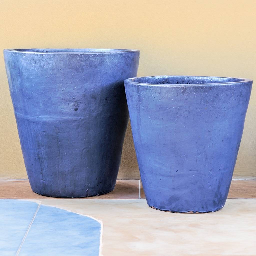 Tapered cylinder pot in matte blue with a wide mouth, featuring a clean, modern silhouette