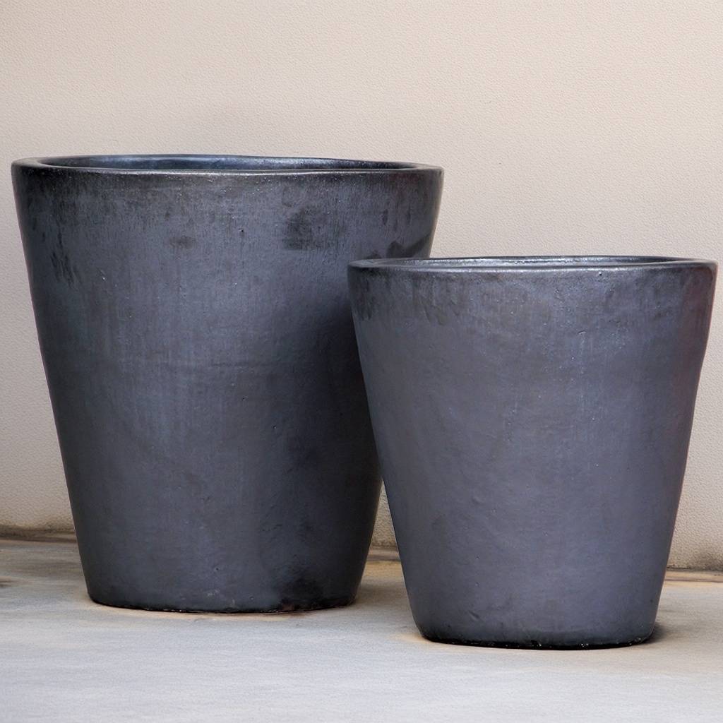Tapered cylinder planter pots with wide mouths in a smooth matte grey finish, ideal for modern indoor or outdoor decor