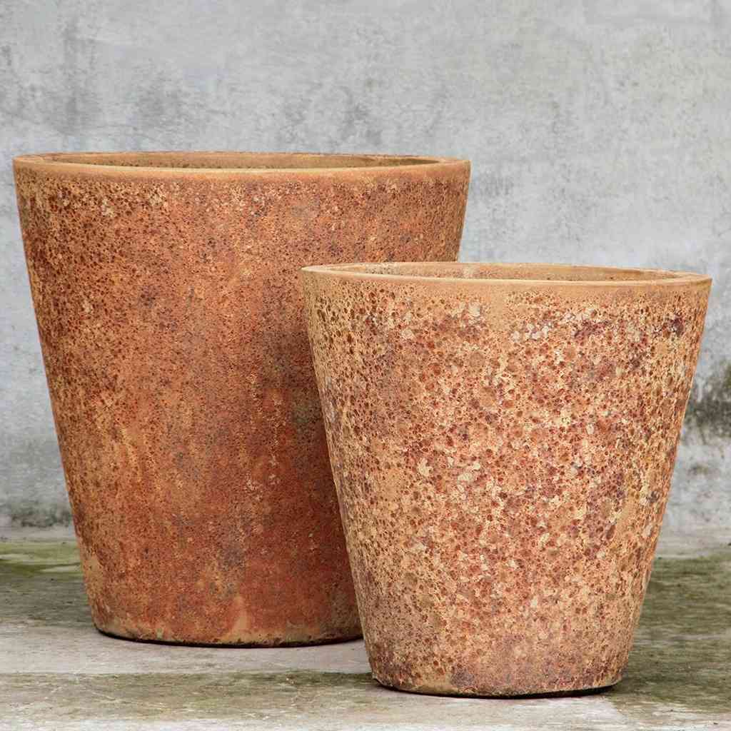 Tapered cylinder planter pots with wide mouth in classic terracotta with a smooth, earthy finish for a timeless, natural look