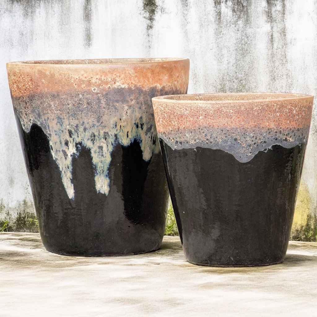 Tapered cylinder planter pots in dark brown featuring a running terracotta design for a warm, rustic look