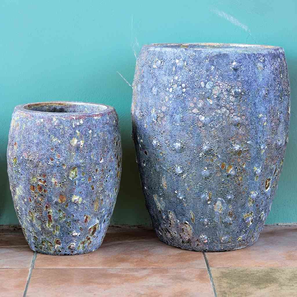 Barrel-shaped planters in deep slate grey with oxides and carbon speckles and raised dot texture