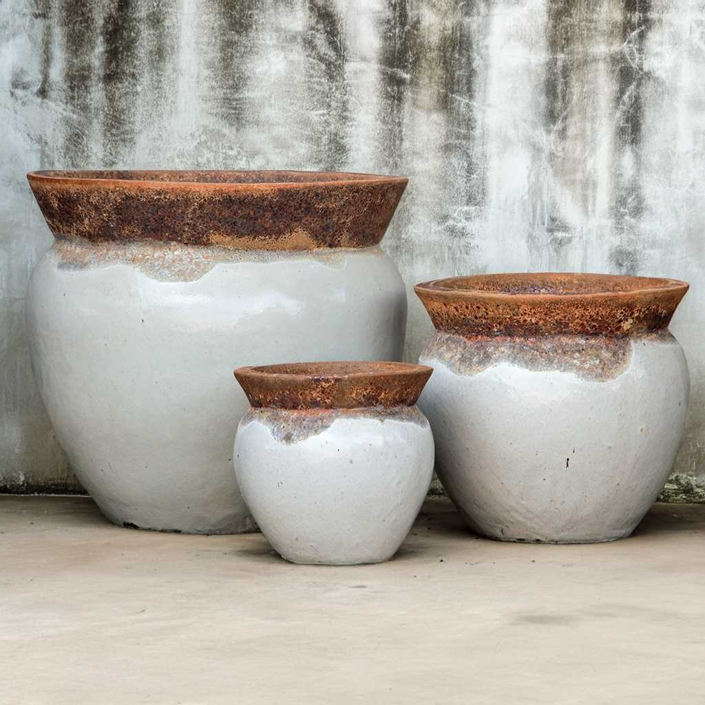 Rim planters in off-white and unglazed reddish-brown finish