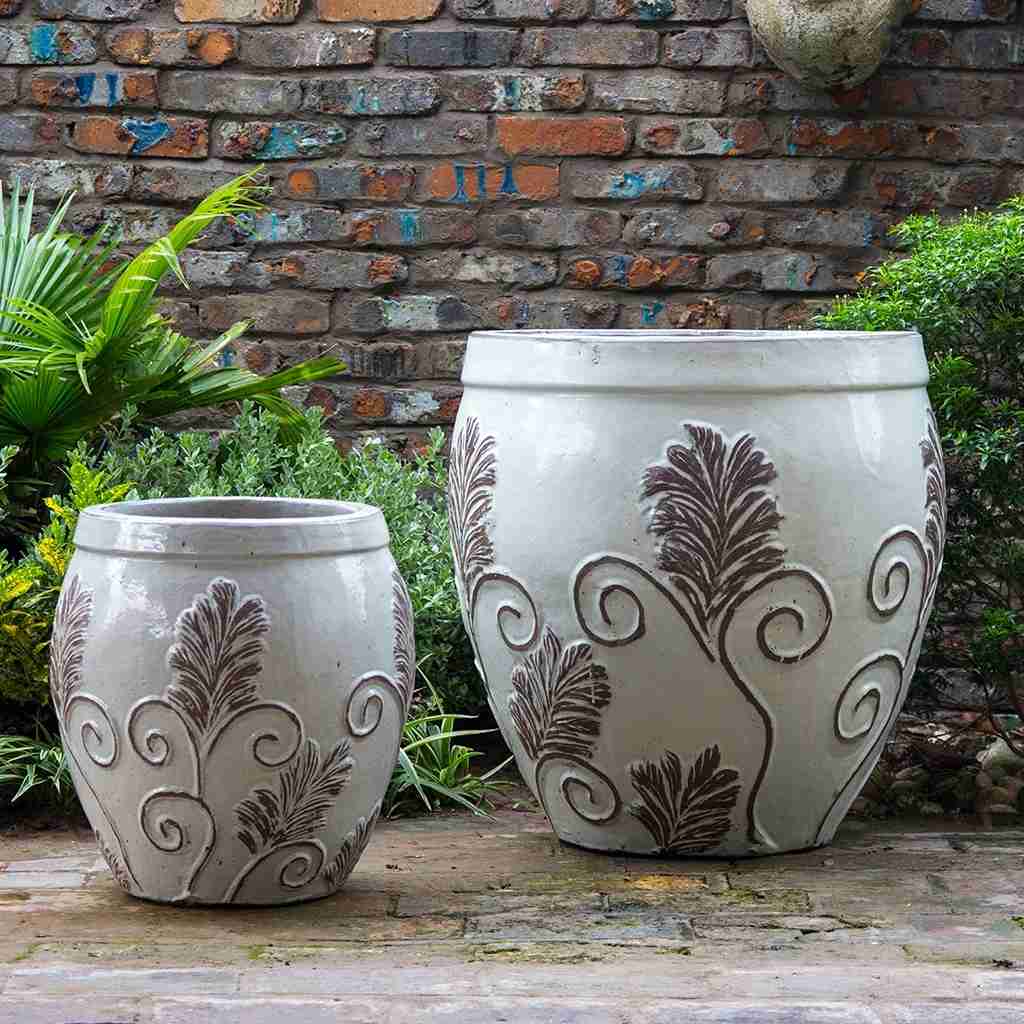 Wholesale set of 2 Rounded ceramic planters in white featuring a detailed brown ornate leaf design