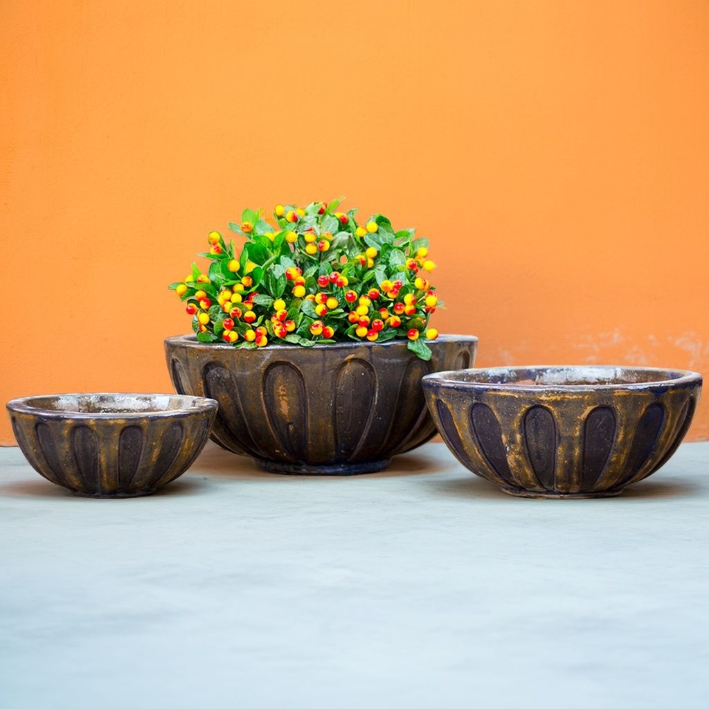 Round low bowl ceramic planters with an antique copper finish for a warm, vintage look