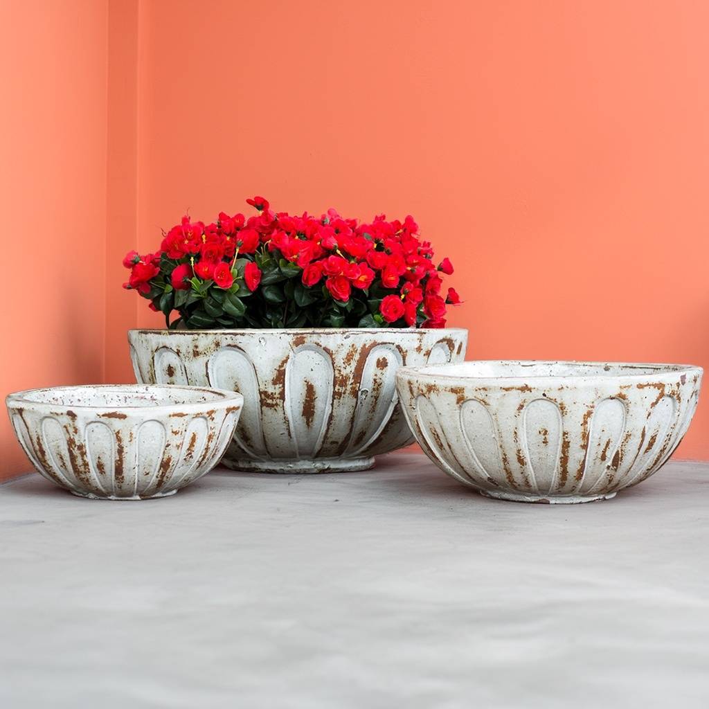 Round low bowl ceramic planters in off-white with distressed brown accents for a rustic, vintage feel
