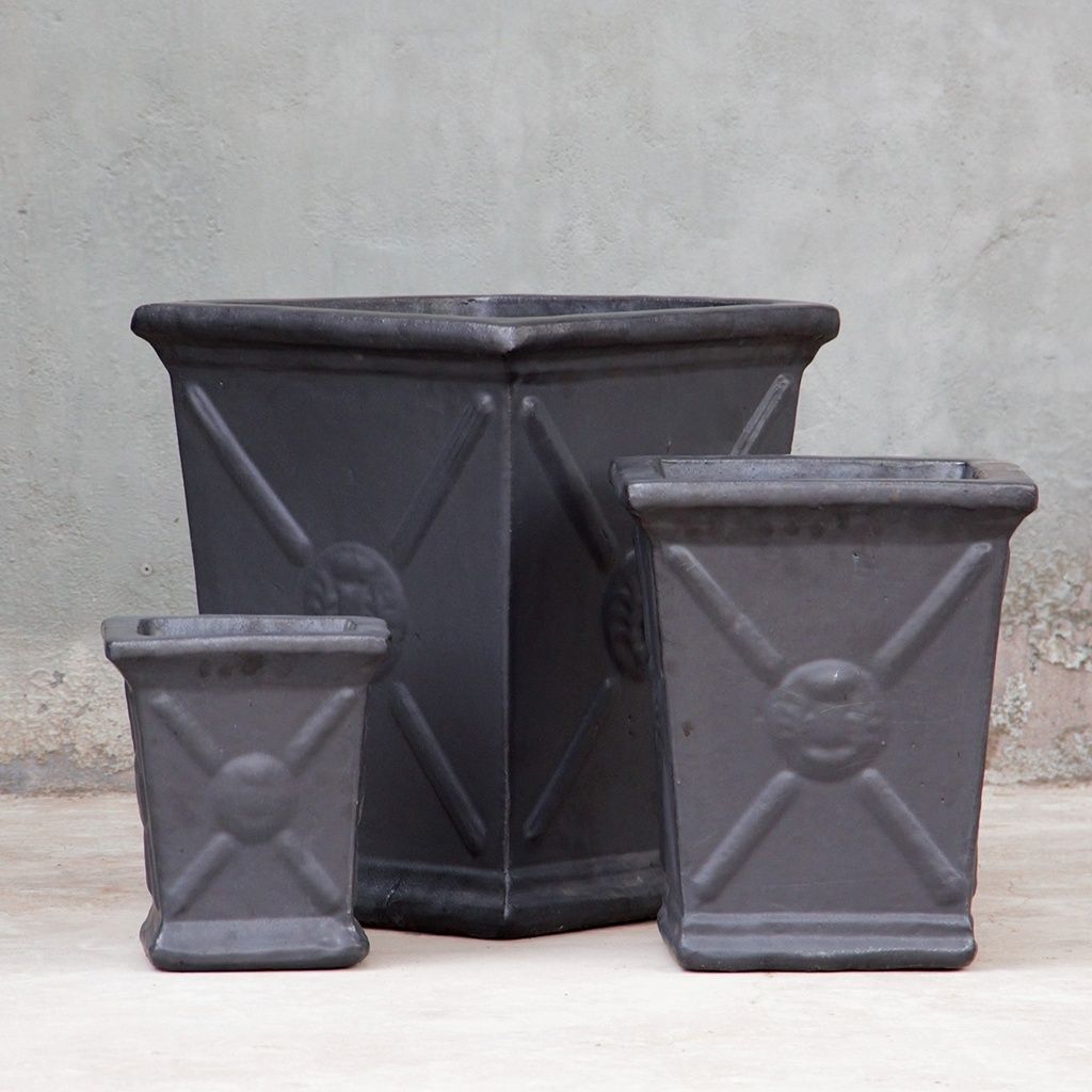 Square ceramic planters in matte gray with a flared rim and embossed regal motif for an elegant, textured design