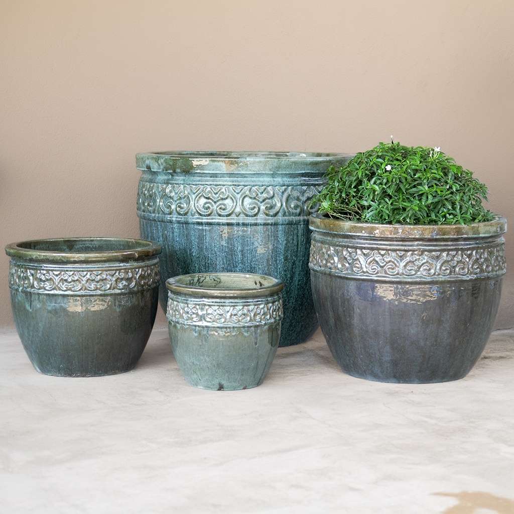 Wide-mouth ceramic planters in dappled sage green and blue-grey hues, featuring a decorative rim for added detail