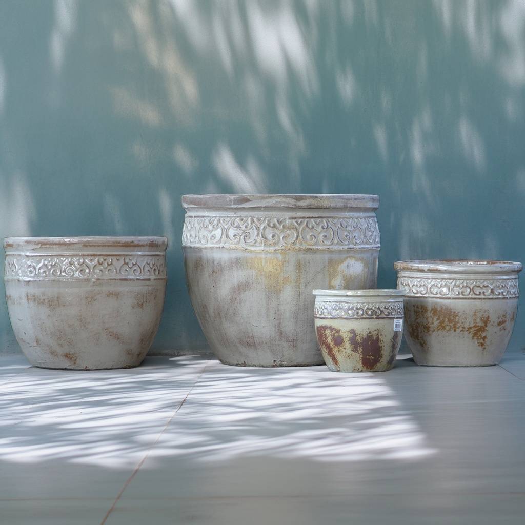 Wide-mouth ceramic planter in antique-style white with muted brown tones and a decorative textured rim for a vintage, elegant look