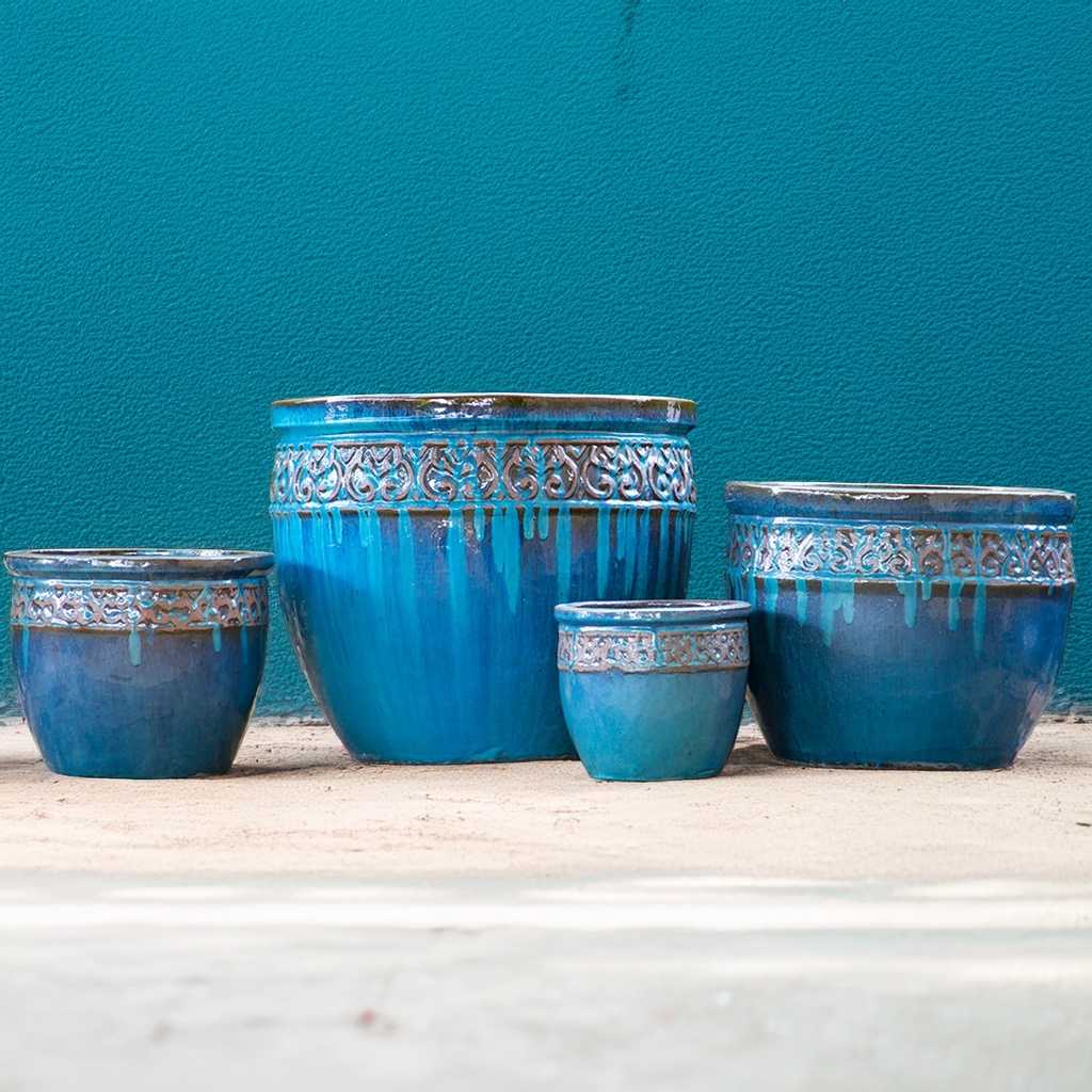 Wide-mouth ceramic planters in rustic blue featuring a decorative rim