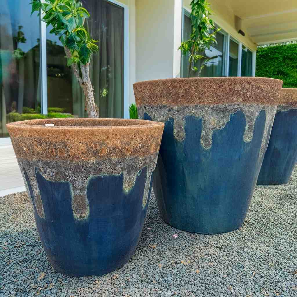Tapered cylinder planter pots with wide mouth in rustic blue, featuring a two-toned glazed finish and a sleek tapered design