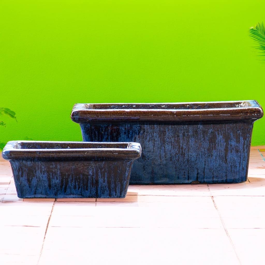 Rectangular tapered planters with a mottled dark blue finish, featuring a textured, artisanal look
