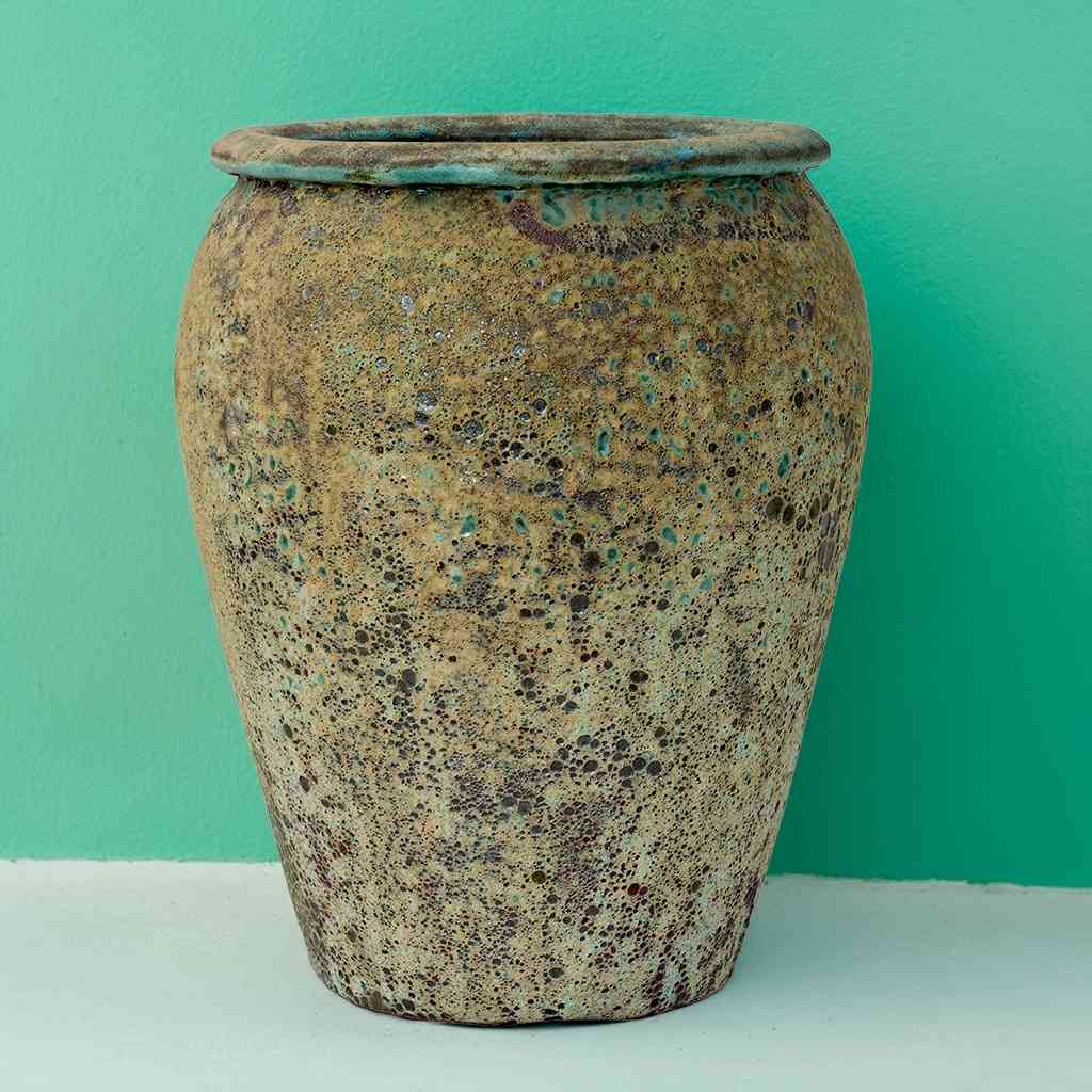 Large egg-shaped planter in brown with speckled green and blue accents for a vibrant, earthy feel