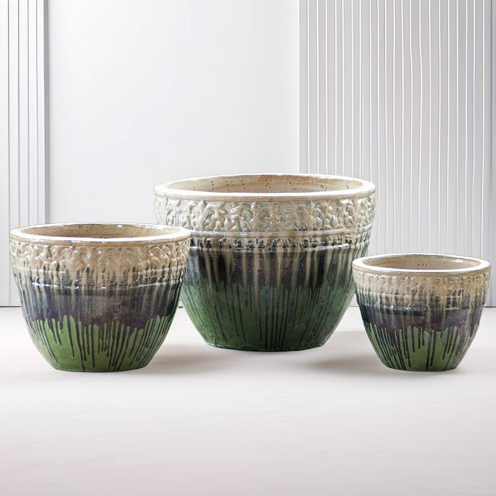 Round ceramic planters with a drip-glazed effect in cream, brown, and light green, featuring embossed floral rims