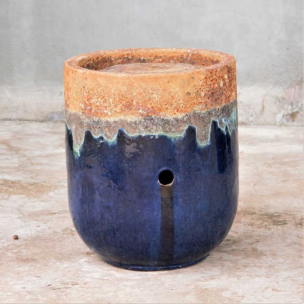 Tall rounded cylinder planters in blue-black with an unglazed rustic top